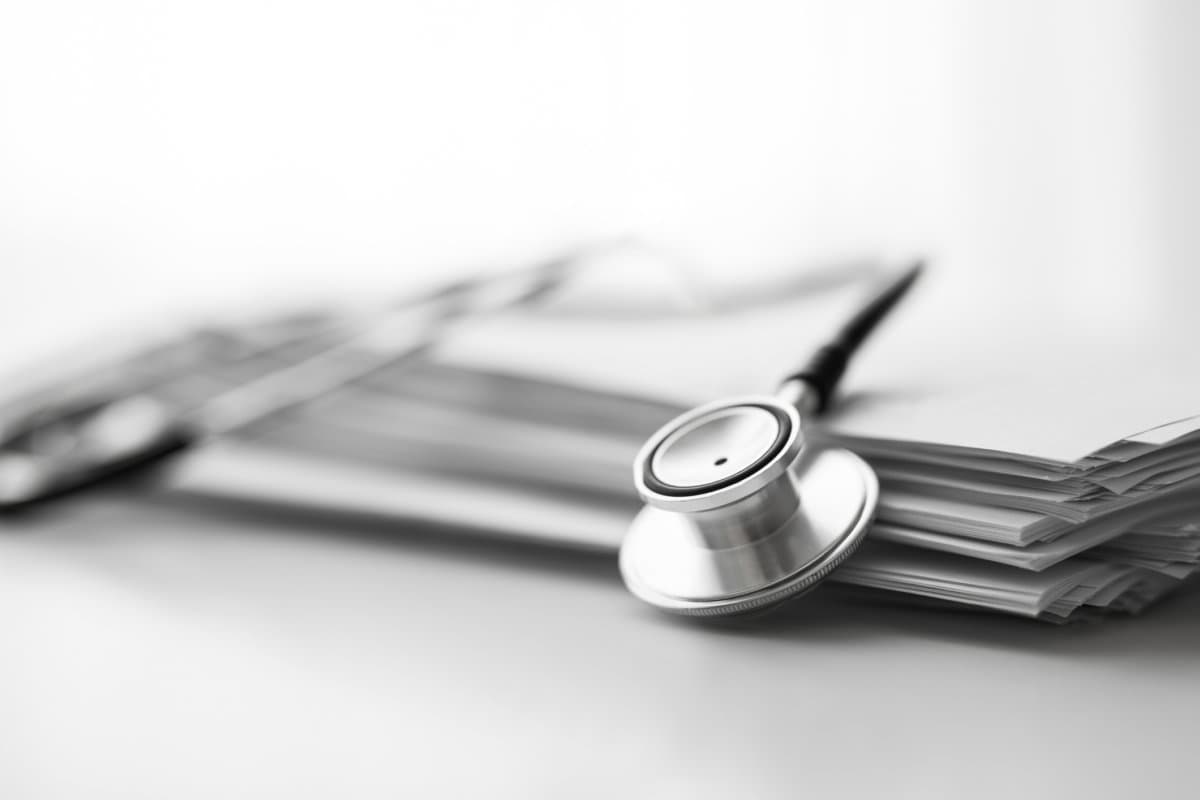 Books folder file with medical data and stethoscope isolated on white background
