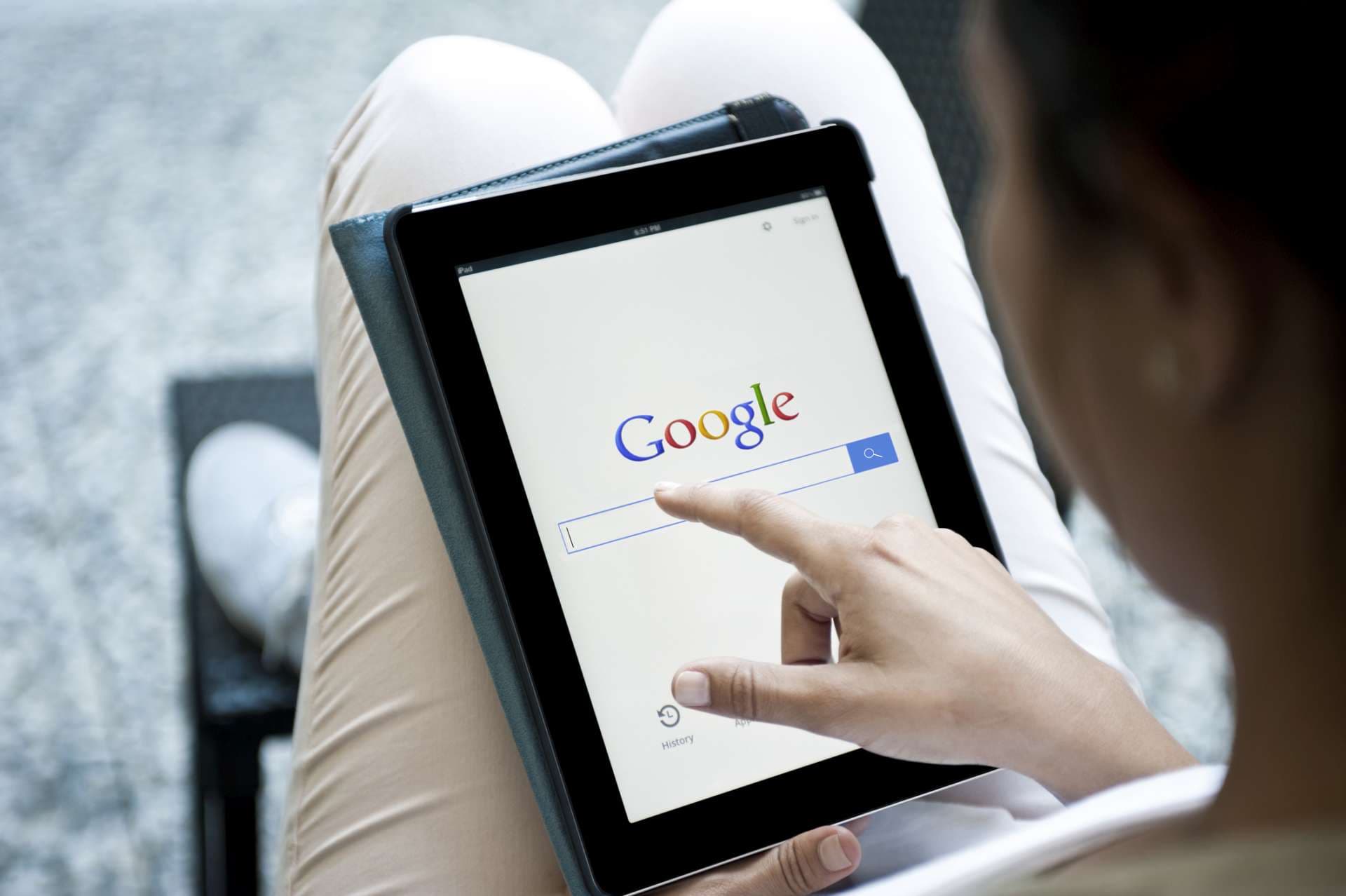 «istanbul, Turkey - July 6, 2012:Hands holding a iPad with Google site.Google Inc. is an American multinational public corporation invested in Internet search, cloud computing, and advertising technologies. iPad produces by Google.»