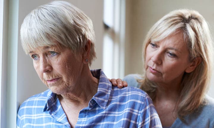 Serious Senior Woman With Adult Daughter At Home