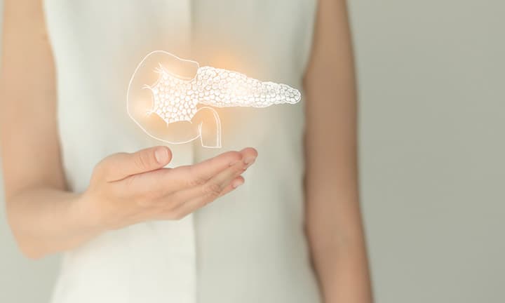 Unrecognizable female patient in white clothes, highlighted handrawn pancreas. Human digestive system issues concept.