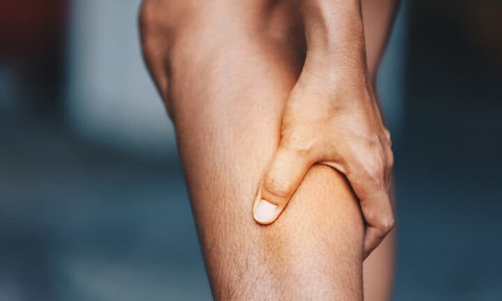 young woman from calf pain, Health care concept