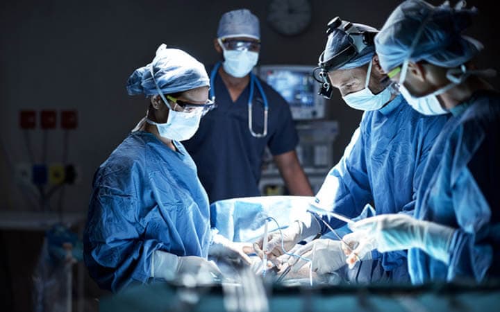 Shot of a team of surgeons performing a surgery in an operating room