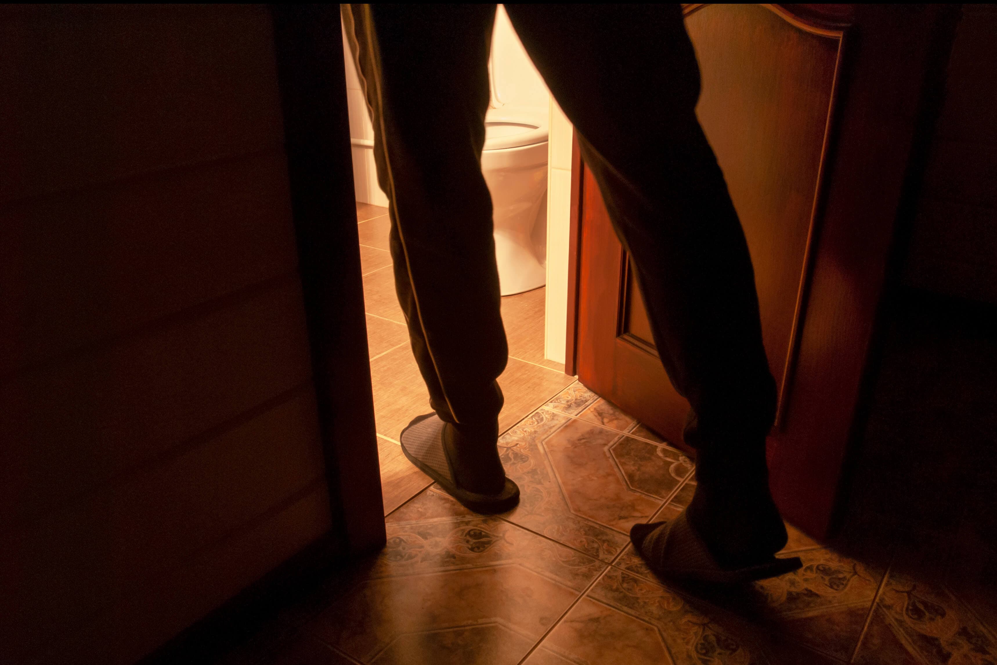 A man with genitourinary problems goes to the toilet at night