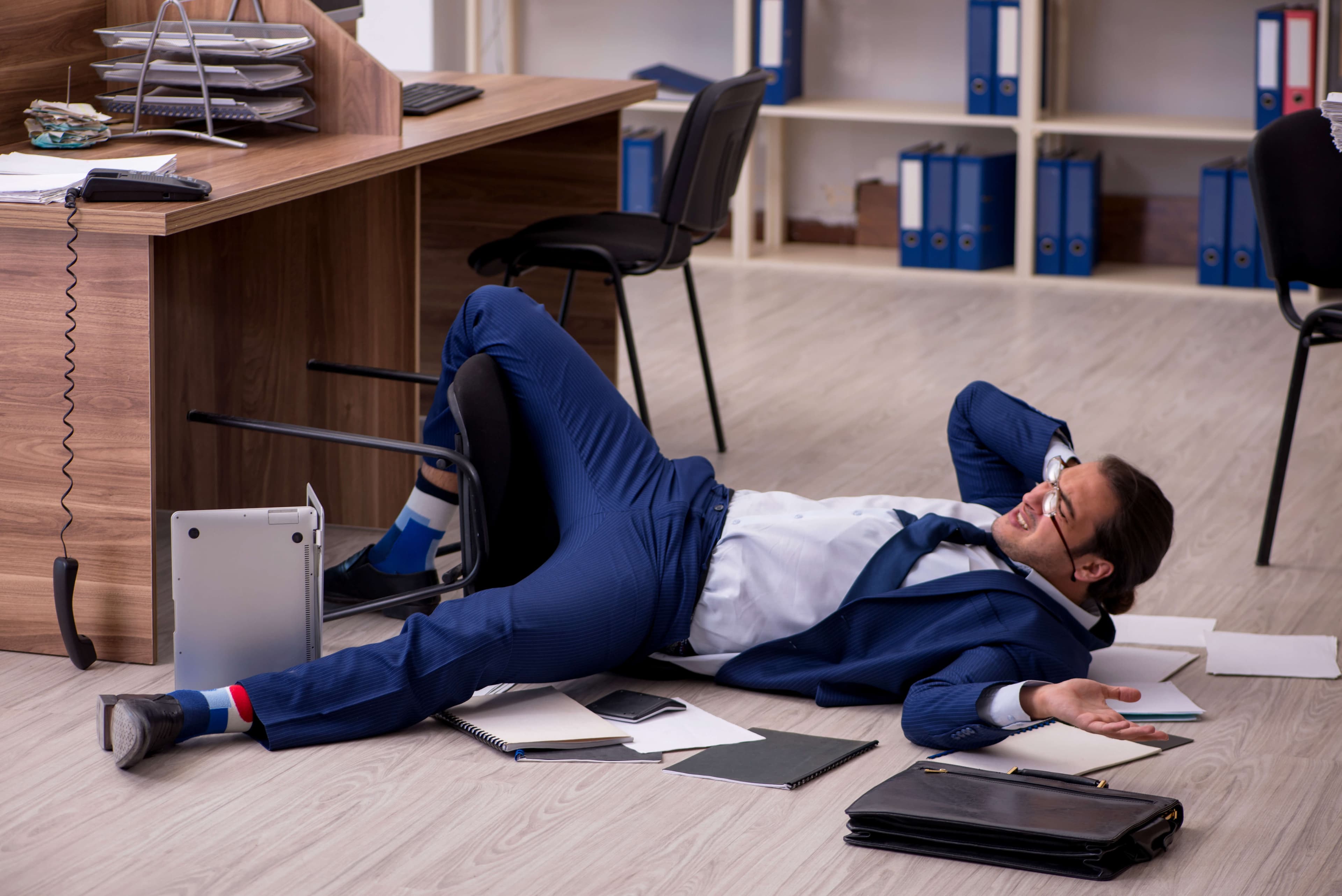 Young businessman employee unhappy with his work in the office