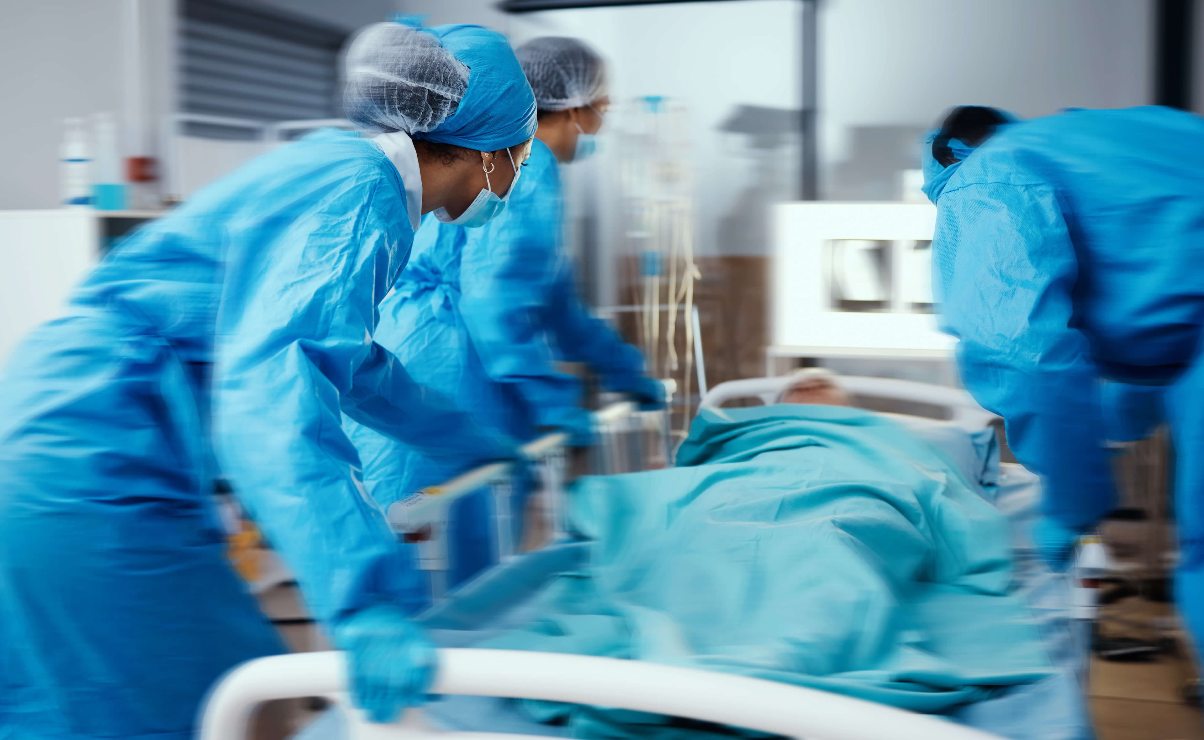 Women, man and hospital bed in motion blur of emergency surgery, healthcare wellness or risk condition operation.