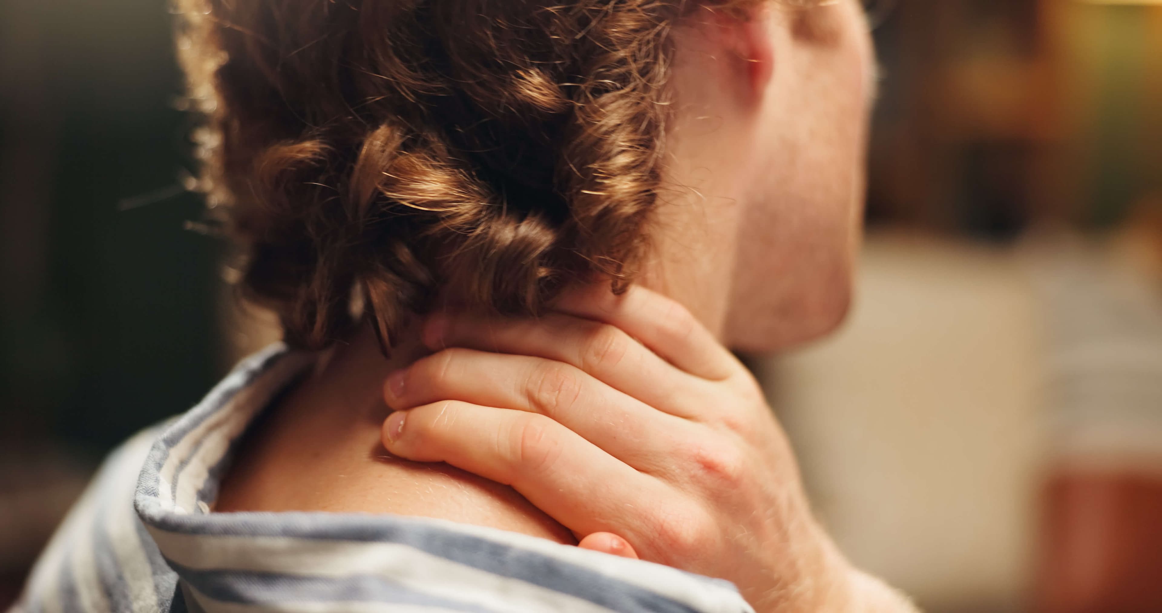 Employee, hand and sore with neck pain, office and man with muscle strain, discomfort and overworked.