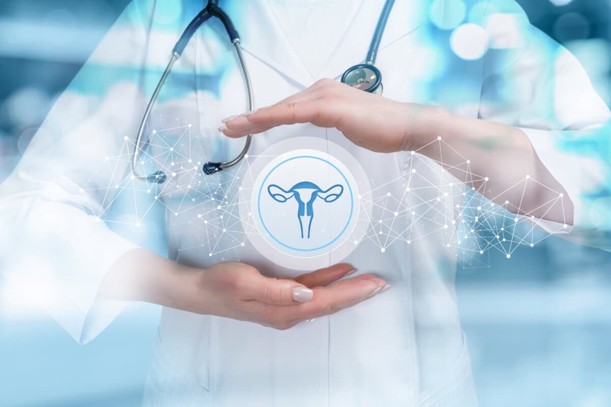 The doctor protects the uterus on a blue background.