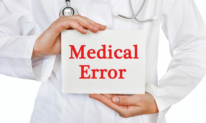 Doctor holding a card with Medical Error, Medical concept