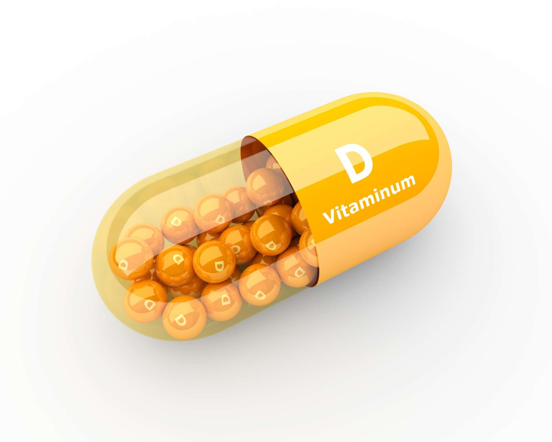 3d Vitamin D Kapsel, die auf Schreibtisch liegt
