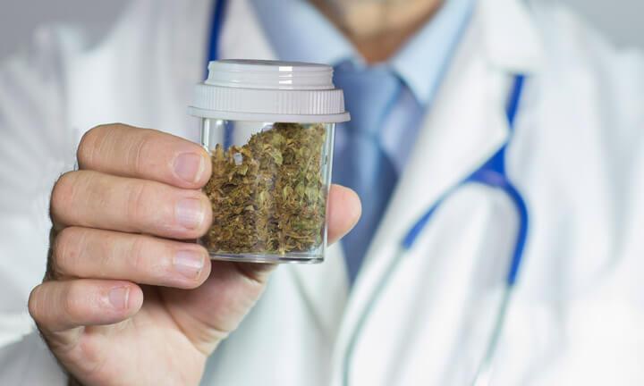 close up of Doctors hands holding medical marijuana